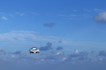Water Sport of Parasailing. Parasailing water amusement. Holiday at the seaside.  Flying on a...