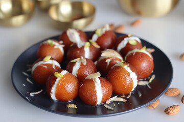 Malai Gulab Jamun. Gulab Jamun sandwich with milk cream filling. Fusion of Indian sweet dessert,...