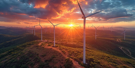 Wind turbines on the mountain at sunset aerial view - obrazy, fototapety, plakaty