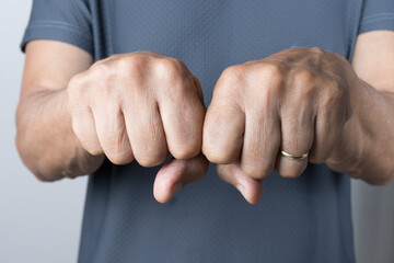 Man extending his hands in a fist position