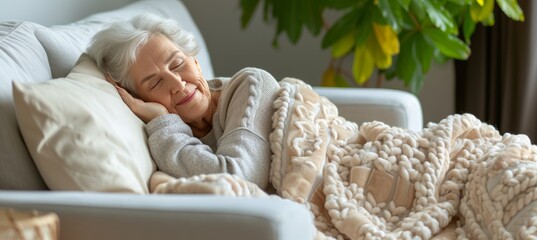 Happy senior woman sleeping peacefully on white bed with blanket, copy space for text