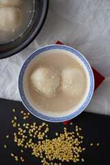 Vietnamese glutinous rice ball dessert with mung beans in simple syrup.