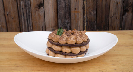 Chocotorta. Closeup view of a cake made with chocolate cookies and dulce de leche cream, in a white dish.
