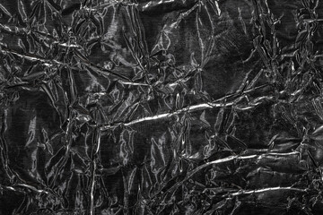 Crumpled shiny metal foil texture