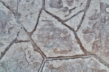 Stamped concrete mosaic patterns, earth tone colors and textures from directly above. A procedure...