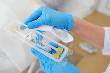 cosmetologist makes a mesotherapy or plasmolifting procedure for the patient. Biorevitalization is...