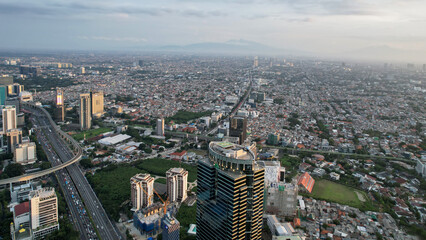 Obraz premium Panoramic cityscape of Indonesia capital city Jakarta at sunset. A rare clear day in the polluted city.