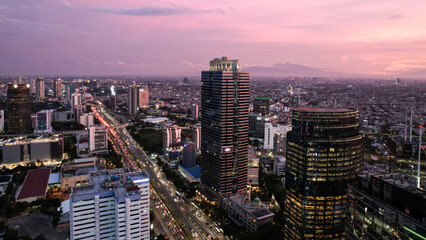 Panoramic cityscape of Indonesia capital city Jakarta at sunset. A rare clear day in the polluted...