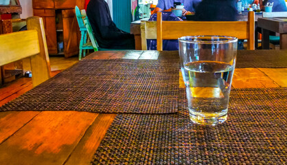 Glass of water on the table in the restaurant Mexico.
