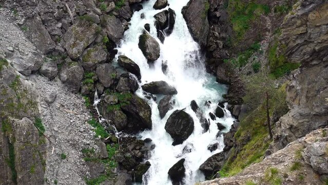 Aerial view of the deep gorge under the zipline in the canyon of Pre-Saint-Didier park, Aosta, Italy 