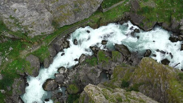 Aerial view of the deep gorge under the zipline in the canyon of Pre-Saint-Didier park, Aosta, Italy 