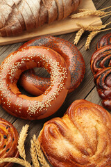 Bakery - various kinds of breadstuff. Bread rolls, bagel, sweet bun. Vertical photo