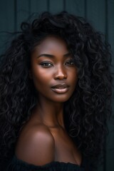 An evocative portrait of an African woman with voluminous, curly black hair, wearing an off-shoulder top, set against a textured dark background, highlighting her strong yet graceful demeanor.