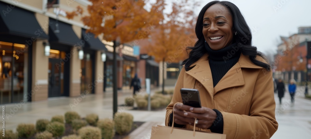 Poster elegant smiling woman using smartphone in shopping center with copy space for text placement