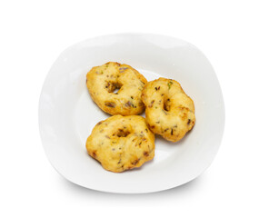 South Indian Vada, Medu vada or dal vadai in a white plate isolated on plain background