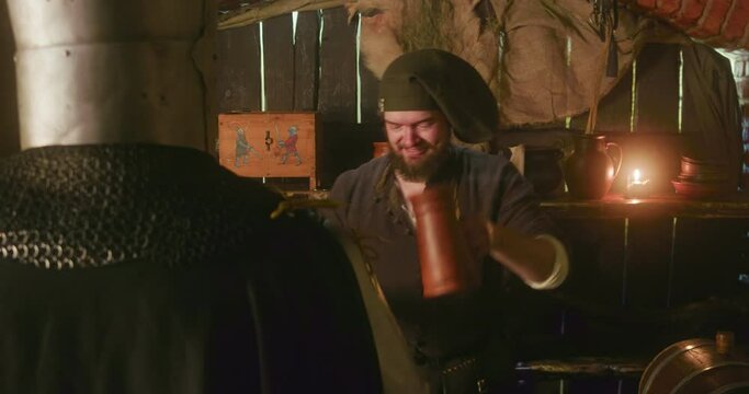 Smiling bearded innkeeper offers alcohol to knight in tavern. Accommodating dwarf bartender in bonnet pours drink for noble lord in hotel. Fairy tale characters