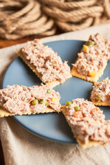 Crackers with tuna salad and mayonnaise
