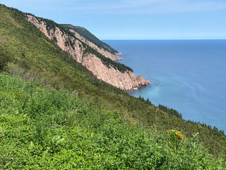 The Cabot Trail, a scenic highway on Cape Breton Island in Nova Scotia, Canada. Rugged coastline in...