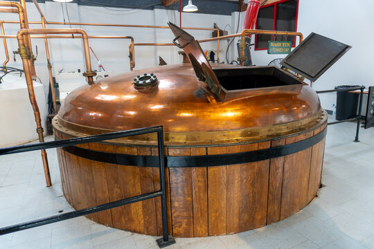 Whisky distillery. Large tank called mash tun or tub for fermentation, agitating, mashing.
