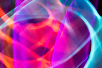 Abstract Neon Lights on Black Background Blurred and Moving 80s Vibe Disco