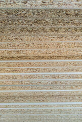 Veneer particle boards pilled on high. Edge details