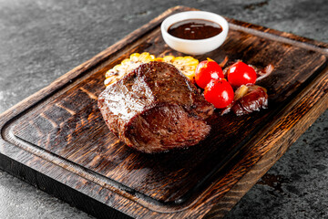 Grilled beef steak filet mignon with sauce in plate