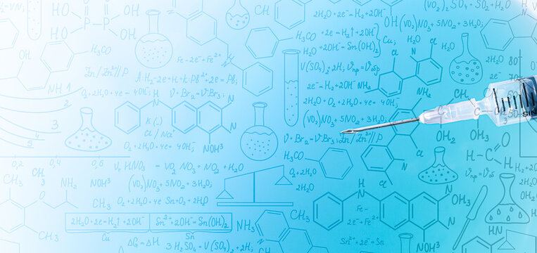 Close-up of syringe on science background,Glass bottle with vaccine and syringe on blue background, close up,Hand drawn science formulas on chalkboard for background