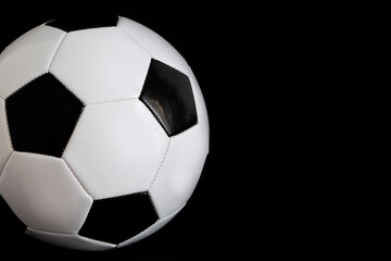 Fototapeta premium classic soccer ball on black background , football black and white color