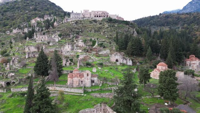 Mystras or Mistras, also known in the Chronicle of the Morea as Myzethras or Myzithras, is a fortified town and a former municipality in Laconia, Peloponnese, Greece. Ruines drone aerial view 