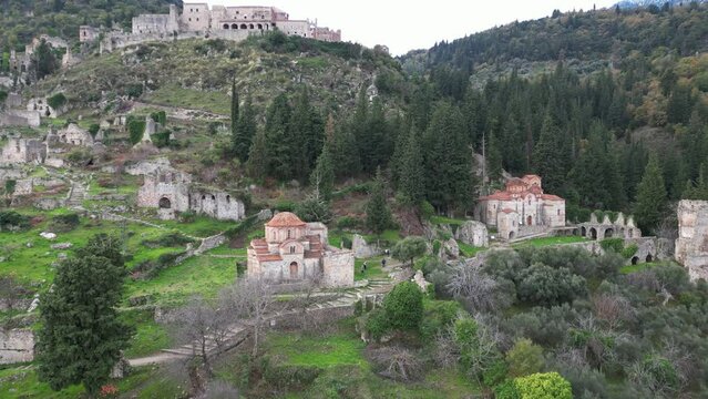 Mystras or Mistras, also known in the Chronicle of the Morea as Myzethras or Myzithras, is a fortified town and a former municipality in Laconia, Peloponnese, Greece. Ruines drone aerial view 