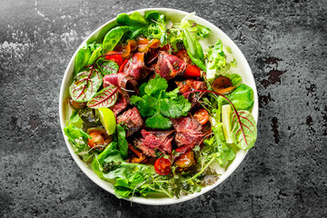 Roastbeef salad with vegetables on plate