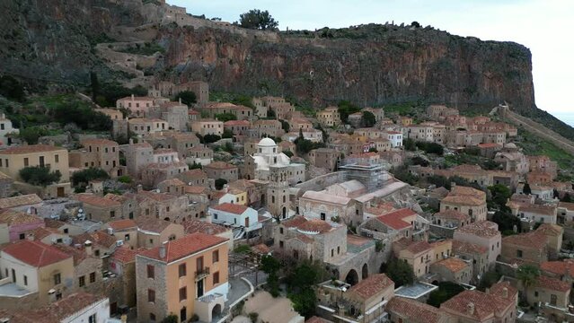 Europe,Greece , Laconia - Monemvasia is a  tied island tourist attraction summer destination in  east coast of the Peloponnese - drone arial view of fortified city with walls by the sea