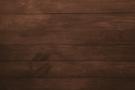 Vintage brown wood background texture with knots and nail holes. Old painted wood wall. Brown abstract background. Vintage wooden dark horizontal boards. Front view with copy space
