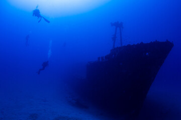 Ship wreck against blue background on a deep dive in Mauritius
