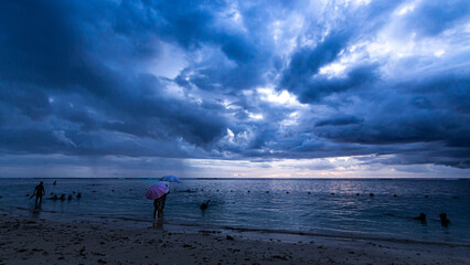 Dramatic clouds on a beautiful beach in Mauritius
