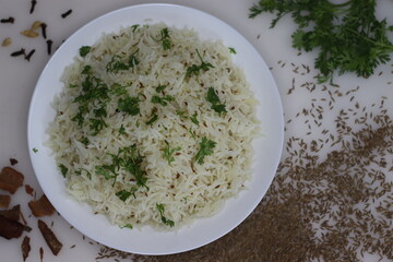 Jeera Bhaat or Jeera Rice. Delicious and aromatic Indian rice dish with basmati rice flavored by cumin seeds and other spices - obrazy, fototapety, plakaty