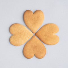 Delicious heart-shaped shortbread cookies on grey background, top view. Homemade cakes