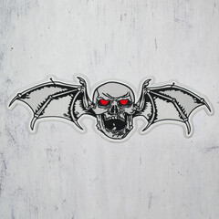 Embroidered patch skull with wings. Accessory for rockers, metalheads, punks, goths.