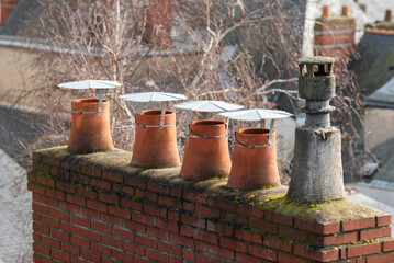 Obraz premium Old chimney on a tenement house in France.