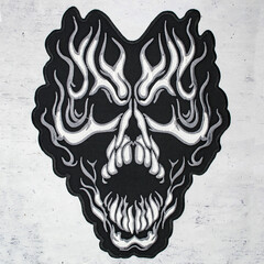 Embroidered patch burning skull. Accessory for rockers, metalheads, punks, goths.