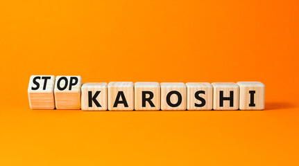 Stop karoshi symbol. Concept words Karoshi or Stop karoshi on beautiful wooden blocks. Beautiful orange table orange background. Business and stop karoshi concept. Copy space.