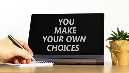 You make your own choice symbol. Concept words You make your own choice on beautiful black tablet....