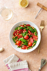 Salad with spinach, sausage, tomatoes and chickpeas. Healthy eating. Diet.