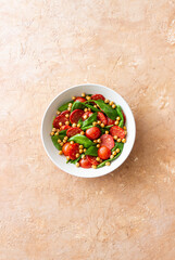 Salad with spinach, sausage, tomatoes and chickpeas. Healthy eating. Diet.