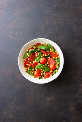 Salad with spinach, sausage, tomatoes and chickpeas. Healthy eating. Diet.