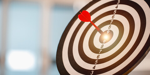 Red dart hitting on the target center dartboard, Business targeting or goal success and winner...