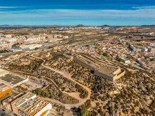 Aerial view of Cartagena port city in Spain surrounded by bastions and fortifications, medieval...