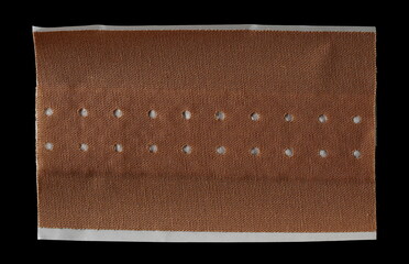 Adhesive bandage new, sticky isolated on black, top view	