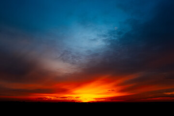 Fototapeta na wymiar Beautiful landscape of colourful dark sunset or sunrise.