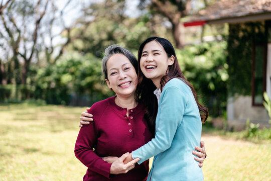 Senior and daughter family concept, Young asian woman smiling and hugging with mother while senior woman